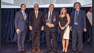 Jen Olmedo-Rodriguez standing with other reward recipients